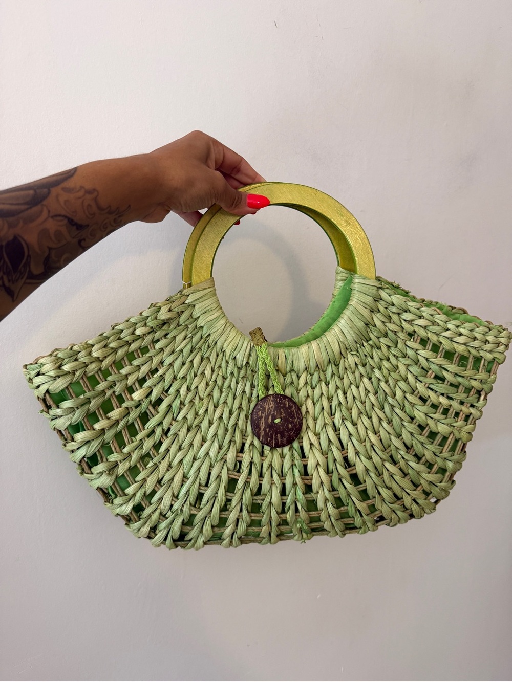 The Sak Green Woven Straw Tote with Round Wood Handles